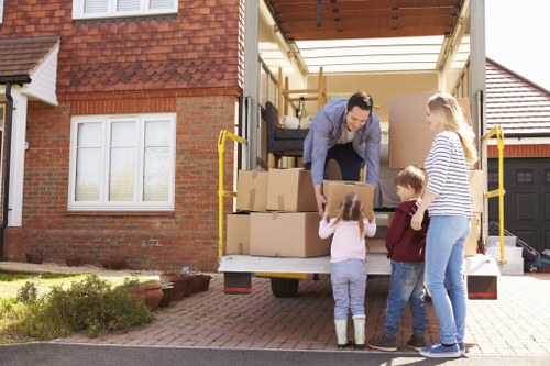 Packed moving boxes and furniture ready for same day transport