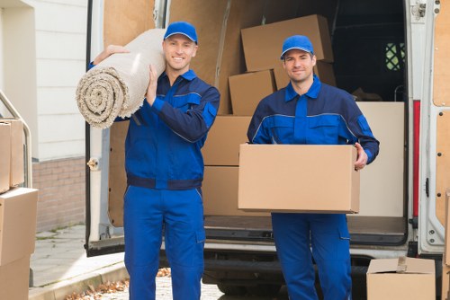 Movers handling large household furniture in Paddington apartment access