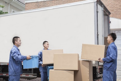 Furniture pick-up service removing a sofa in Paddington